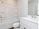 Bright bathroom with a shower-tub combination, toilet, and vanity with a sink at 714 Ocmulgee Xing, Locust Grove, GA 30248