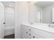 Clean bathroom with a tub-shower, double sinks, and neutral color scheme at 714 Ocmulgee Xing, Locust Grove, GA 30248