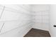 Walk-in pantry with white wire shelving providing ample storage space for groceries and kitchen essentials at 714 Ocmulgee Xing, Locust Grove, GA 30248