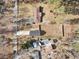 Aerial view of a grey home with a long driveway and a large fenced backyard at 860 Gardner Sw St, Austell, GA 30168