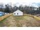 The home's backyard features level ground, grass, and a privacy fence at 860 Gardner Sw St, Austell, GA 30168