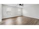 Large bedroom with modern ceiling fan and windows at 860 Gardner Sw St, Austell, GA 30168