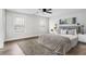 Nicely decorated modern bedroom with area rug, ceiling fan and bright windows at 860 Gardner Sw St, Austell, GA 30168