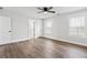 This bedroom features hardwood floors, white trim, and windows for ample natural light at 860 Gardner Sw St, Austell, GA 30168