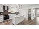 Modern kitchen featuring stainless appliances, a large island and convenient pantry access at 860 Gardner Sw St, Austell, GA 30168