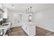 Well-lit kitchen with stainless steel appliances, kitchen island and recessed lights at 860 Gardner Sw St, Austell, GA 30168