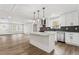 Modern kitchen with white cabinets, stainless steel appliances, and a large island at 860 Gardner Sw St, Austell, GA 30168