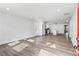 Open-concept living room with modern finishes and views into the kitchen with stainless steel appliances at 860 Gardner Sw St, Austell, GA 30168