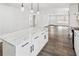 Bright, open-concept living space with hardwood floors and recessed lighting throughout at 860 Gardner Sw St, Austell, GA 30168