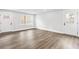 Neutral room with white trim, two windows, and a door to the backyard at 860 Gardner Sw St, Austell, GA 30168