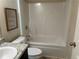 Bathroom with granite countertop and shower-tub combo at 3885 Nixon Grove Dr, Douglasville, GA 30135