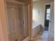 Bright bathroom features a glass-enclosed shower and soaking tub at 3885 Nixon Grove Dr, Douglasville, GA 30135