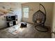 Playful bedroom with a hanging chair and airplane themed decor at 3885 Nixon Grove Dr, Douglasville, GA 30135