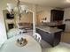 Open concept kitchen with granite countertops, stainless appliances, and arched entry to the living room at 3885 Nixon Grove Dr, Douglasville, GA 30135