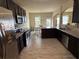 Spacious kitchen featuring stainless steel appliances, granite countertops, and a breakfast bar at 3885 Nixon Grove Dr, Douglasville, GA 30135