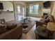 Bright living room featuring a fireplace, large windows, and neutral tones offers a welcoming space at 3885 Nixon Grove Dr, Douglasville, GA 30135