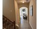 Inviting entryway showcases an archway into the cozy living room with fireplace and media center at 3885 Nixon Grove Dr, Douglasville, GA 30135