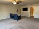 Comfortable main bedroom featuring carpet, two armchairs, and natural light at 3885 Nixon Grove Dr, Douglasville, GA 30135