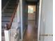 Inviting hallway with stairs and view to kitchen at 4052 Pocono Ct, Stone Mountain, GA 30083