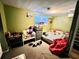 Cluttered basement featuring a bed, dresser, and small window at 3928 Potomac Nw Dr, Kennesaw, GA 30144