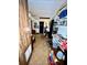 A cluttered basement with tiled floor and a variety of items on shelves at 3928 Potomac Nw Dr, Kennesaw, GA 30144