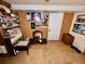 A cluttered basement featuring tiled floors and wood paneled walls at 3928 Potomac Nw Dr, Kennesaw, GA 30144