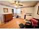 Bedroom featuring a ceiling fan, dresser, and hardwood floors at 3928 Potomac Nw Dr, Kennesaw, GA 30144