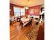 Traditional dining room with wood floors, a decorative table setting, and natural lighting at 3928 Potomac Nw Dr, Kennesaw, GA 30144