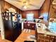 Compact kitchen features classic appliances, wooden cabinetry, and efficient counter space at 3928 Potomac Nw Dr, Kennesaw, GA 30144