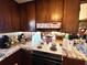 Functional kitchen with retro appliances, ample wood cabinet storage, and marble-style countertops at 3928 Potomac Nw Dr, Kennesaw, GA 30144