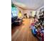 A cozy living room with a comfortable armchair, hardwood floors, and a festive Christmas tree at 3928 Potomac Nw Dr, Kennesaw, GA 30144