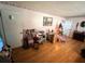 Bright living room with hardwood floors, a doorway, and a Christmas tree at 3928 Potomac Nw Dr, Kennesaw, GA 30144