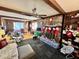 Cozy living area featuring brick fireplace with stockings, ceiling fan, and comfortable sofa at 3928 Potomac Nw Dr, Kennesaw, GA 30144