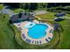 Community pool with surrounding lounge chairs and clubhouse at 4010 Sierra Vista Cir, Cumming, GA 30040