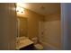 Clean bathroom with a tub/shower combo and dark vanity at 7765 Haynes Park Cir, Lithonia, GA 30038