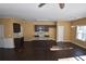 Eat-in kitchen with dark cabinetry, granite countertops, and an island at 7765 Haynes Park Cir, Lithonia, GA 30038