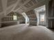 Attic featuring dormer windows for natural light and unfinished walls at 839 Braselton Hwy, Lawrenceville, GA 30043