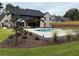 Expansive backyard featuring a sparkling pool, spa, and lush landscaping at 839 Braselton Hwy, Lawrenceville, GA 30043