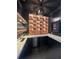 Sleek home bar with illuminated display shelves, stainless steel appliances, and dark cabinetry at 839 Braselton Hwy, Lawrenceville, GA 30043