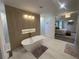 Luxurious bathroom with a freestanding tub, modern fixtures, and access to main bedroom at 839 Braselton Hwy, Lawrenceville, GA 30043