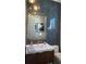 Stylish bathroom featuring a vanity, designer mirror, and herringbone tile wall at 839 Braselton Hwy, Lawrenceville, GA 30043