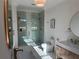 Bright bathroom with dual shower heads, marble counters, and modern fixtures at 839 Braselton Hwy, Lawrenceville, GA 30043