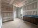 Unfinished bathroom featuring a walk-in shower, floating shelves, and a vanity at 839 Braselton Hwy, Lawrenceville, GA 30043