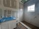 Bathroom featuring a new vanity, marble tile and a new shower with window, with unfinished walls at 839 Braselton Hwy, Lawrenceville, GA 30043