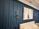 Bedroom showcases textured blue accent wall and stylish sconce lighting at 839 Braselton Hwy, Lawrenceville, GA 30043