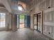 Bright foyer with tall ceilings, large windows, and a modern black steel door at 839 Braselton Hwy, Lawrenceville, GA 30043