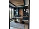 A modern home office with custom built-ins, wood ceiling, and natural light at 839 Braselton Hwy, Lawrenceville, GA 30043