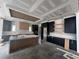 An unfinished kitchen featuring dark cabinets, wood paneled island, a paneled ceiling design, and modern finishes at 839 Braselton Hwy, Lawrenceville, GA 30043