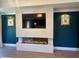 Cozy living room with a modern fireplace, large screen TV, and sophisticated decor at 839 Braselton Hwy, Lawrenceville, GA 30043