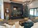 Cozy living room with a sleek fireplace, modern decor, and large windows for natural light at 839 Braselton Hwy, Lawrenceville, GA 30043